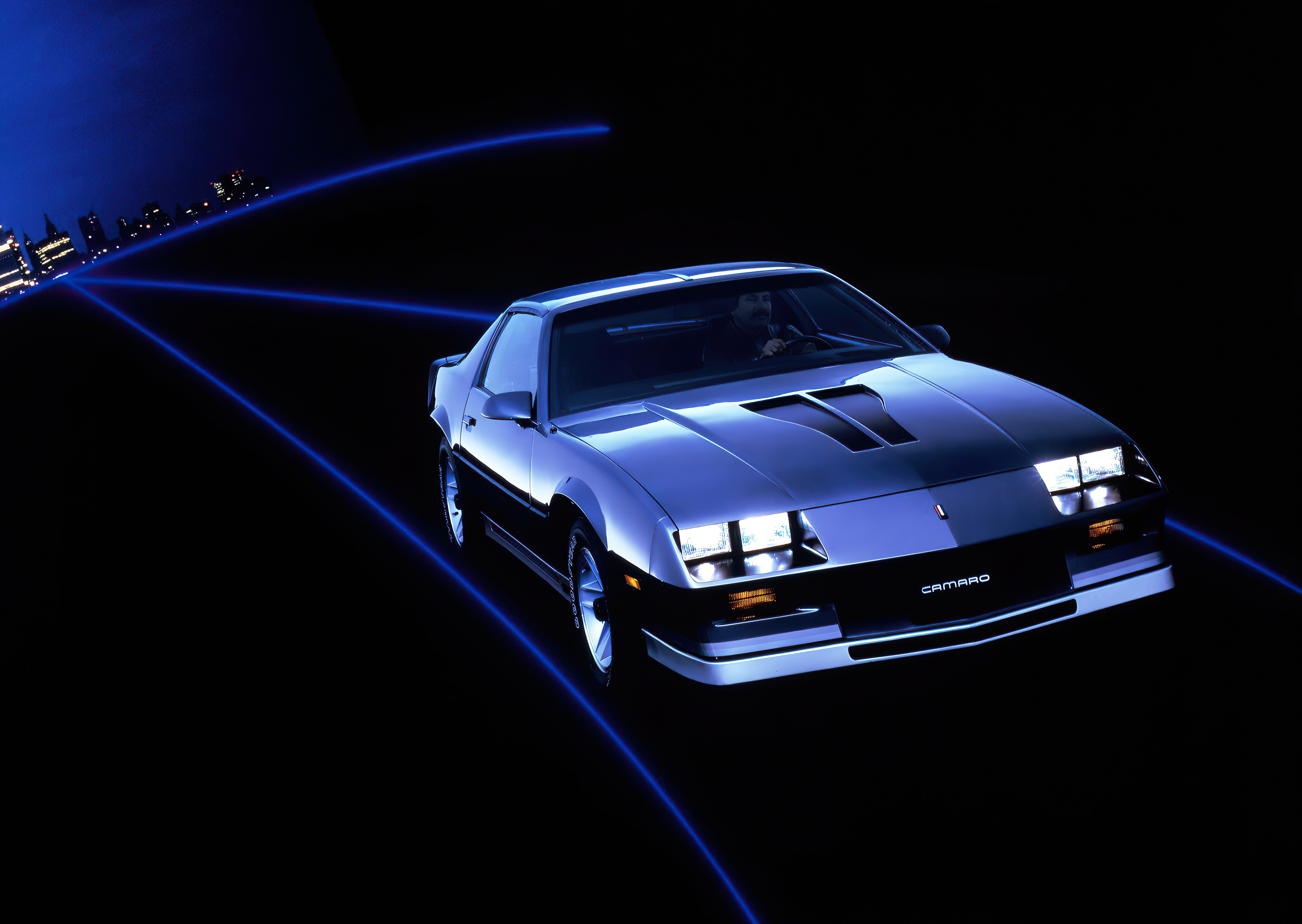 Chevrolet Camaro on a dark road with blue light trails HD Wallpaper
