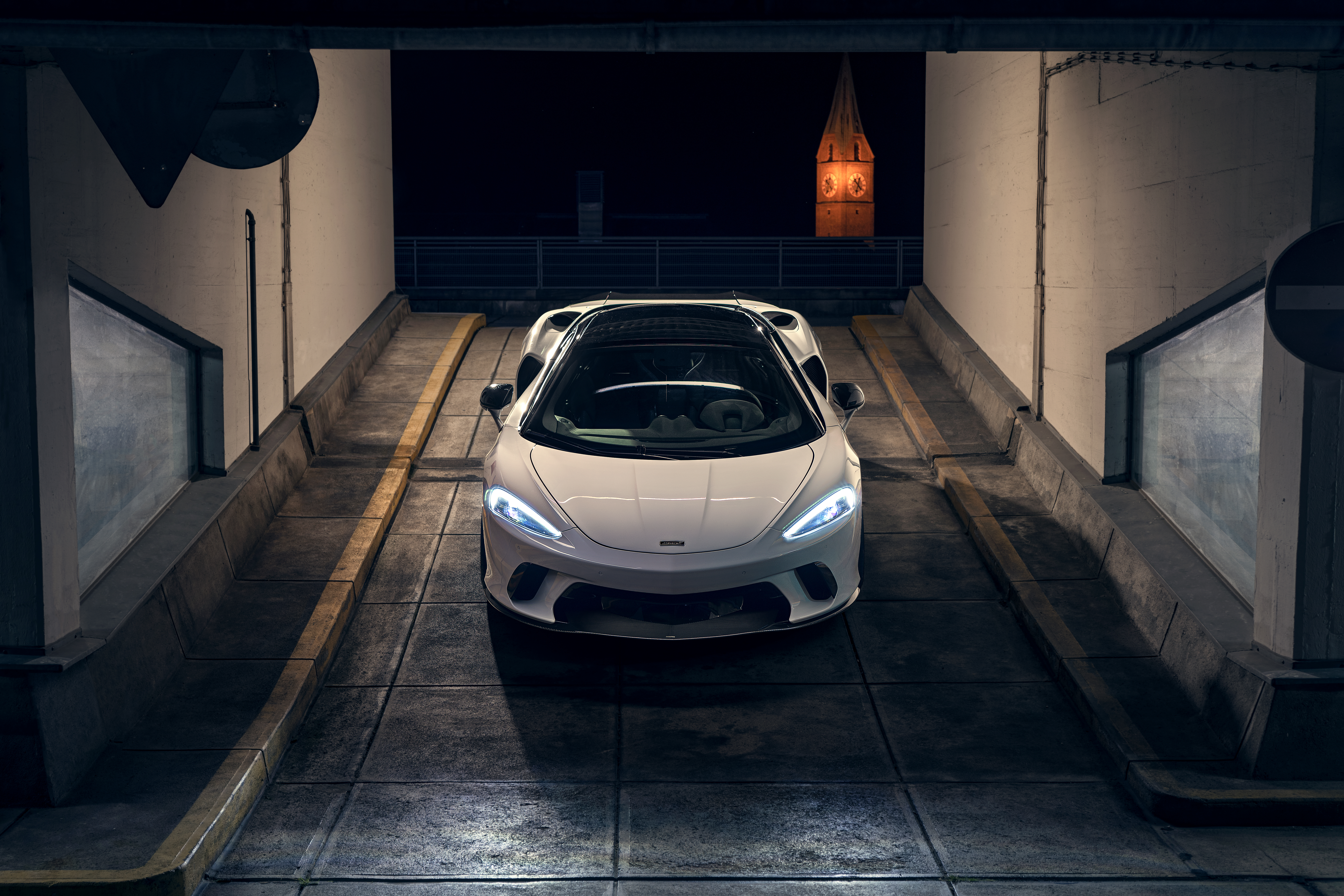 White McLaren GT in a concrete tunnel at night HD Wallpaper