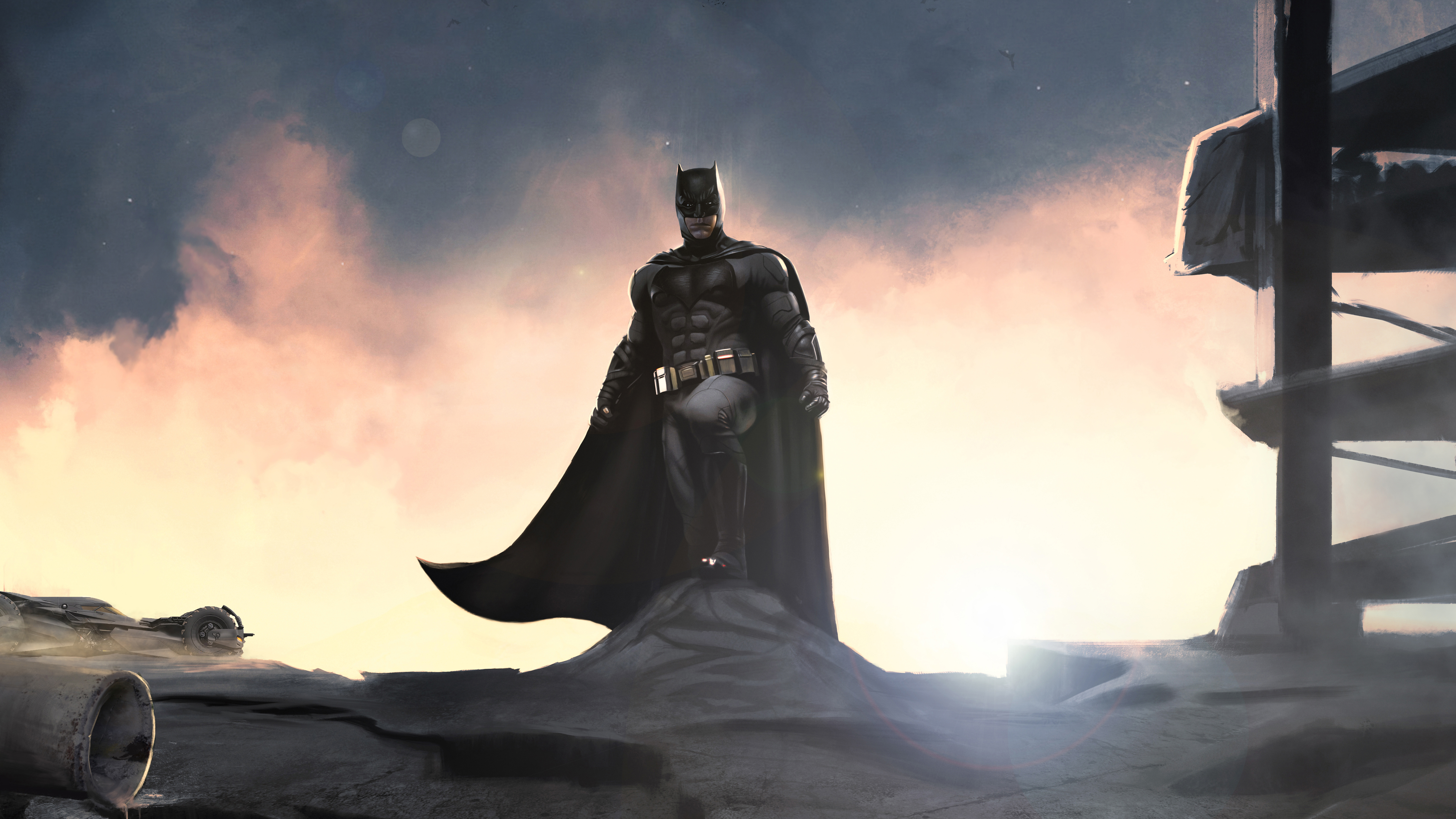 Batman standing on rubble at sunset HD Wallpaper