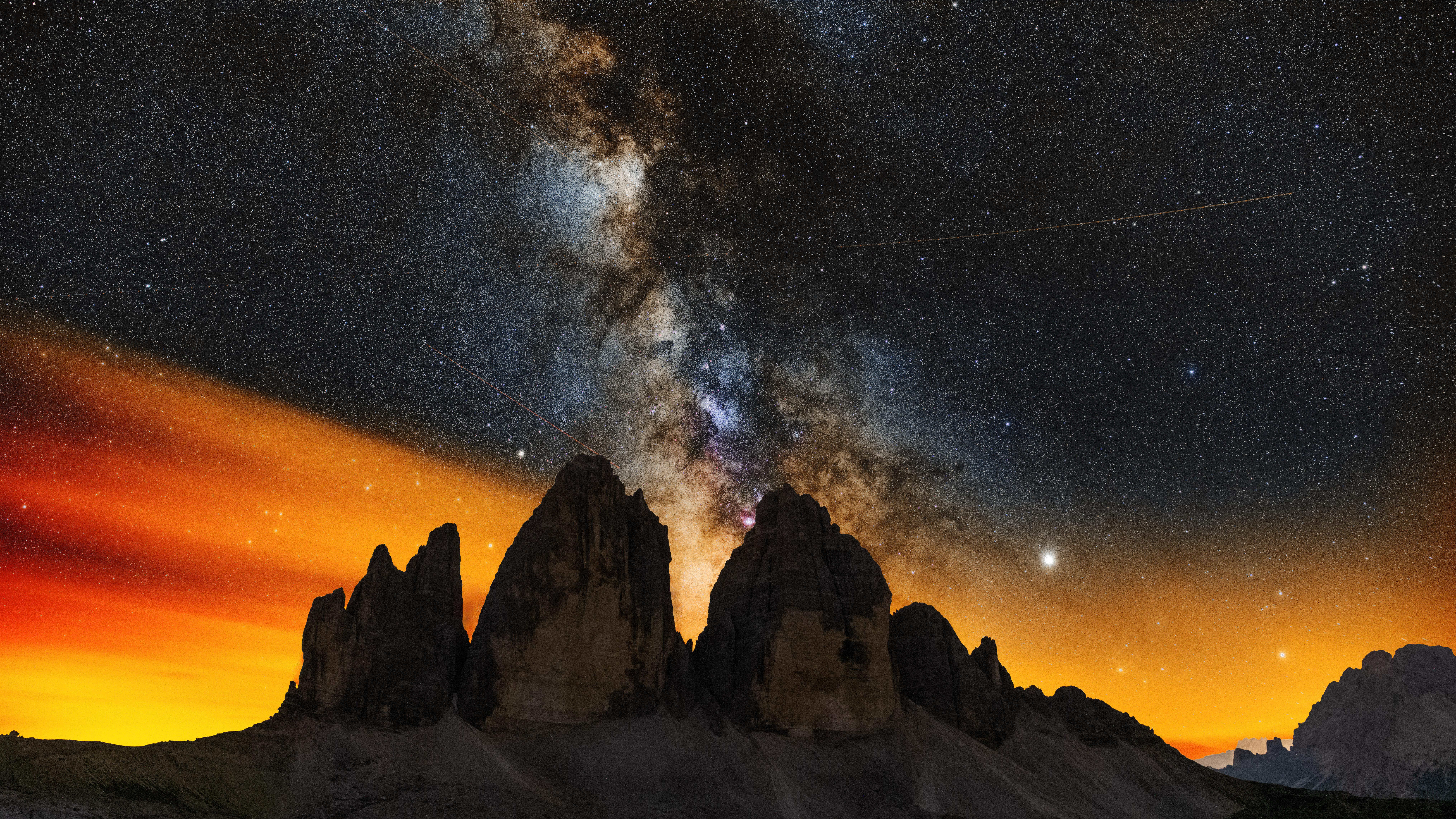 Milky Way over jagged mountains at night HD Wallpaper