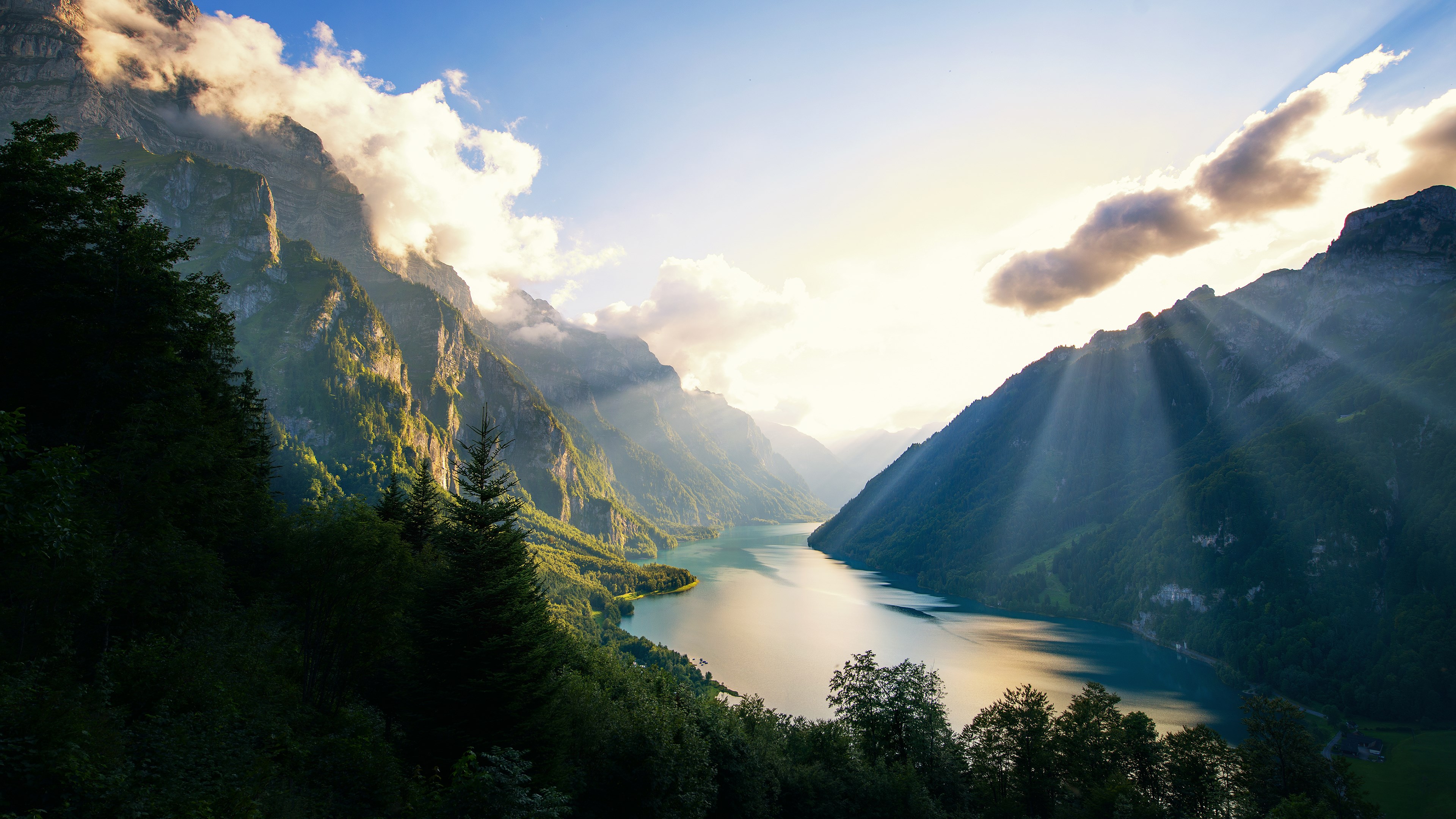 Mountains and lake at sunrise with sunbeams HD Wallpaper