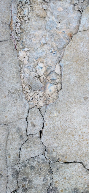 Cracked concrete texture with rubble