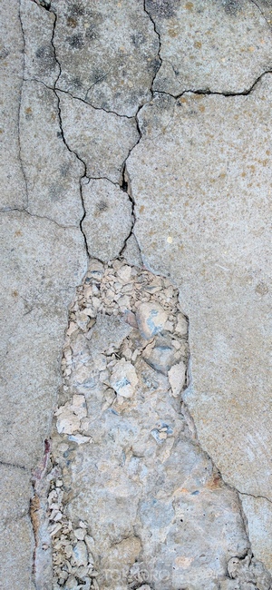 Cracked concrete texture with broken pieces