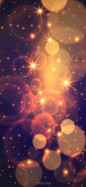 Abstract bokeh and starbursts on dark background
