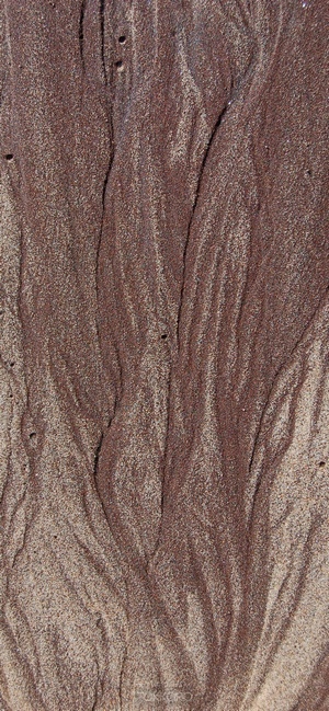 Brown sand with water patterns