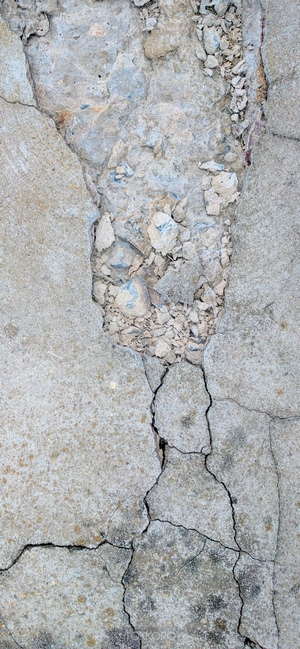 Cracked concrete texture with rubble