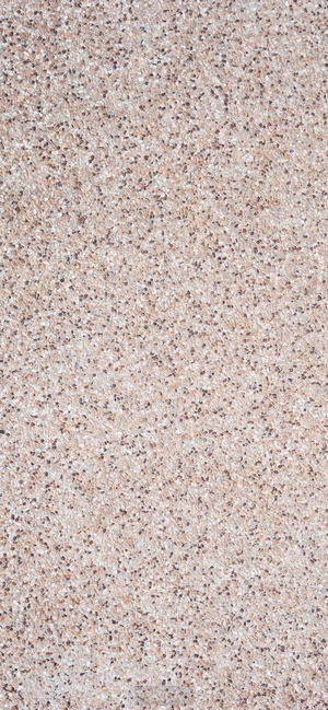 Textured concrete pattern with small pebbles