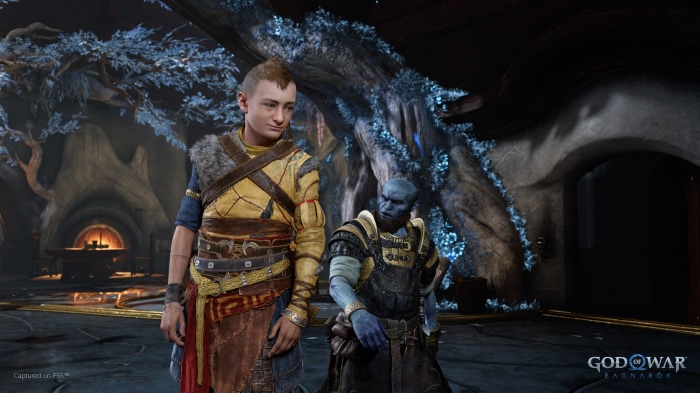 Atreus and a blue-skinned dwarf from God of War Ragnarök