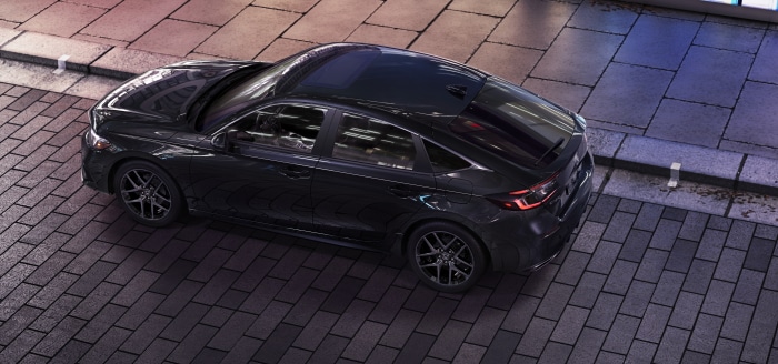 2022 Honda Civic Hatchback Sport Touring parked on a brick street
