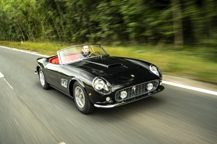 Black Ferrari California Spyder revival by GTO Engineering driving on road