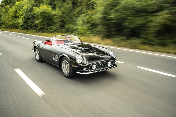 Black Ferrari 250 GT California Spyder Revival by GTO Engineering driving on road