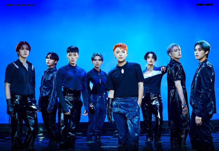 ATEEZ members posing against a blue background