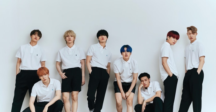 ATEEZ members in white polo shirts