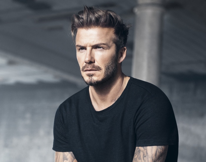David Beckham wearing a black t-shirt