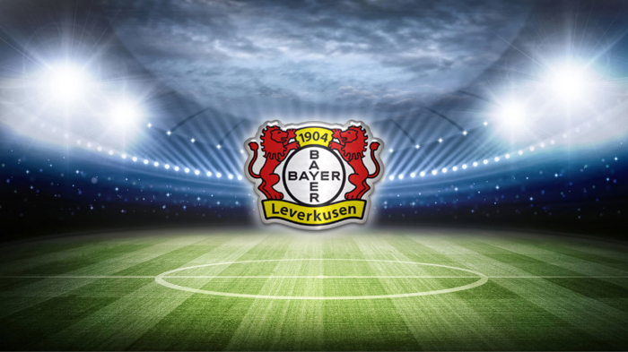Bayer 04 Leverkusen logo on a soccer field