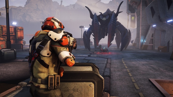 Phoenix Point soldier facing a large alien creature