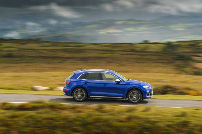 Blue Audi SQ5 TDI 4K SUV driving on a road