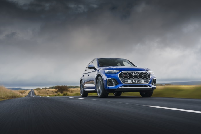 Blue Audi SQ5 TDI 4K SUV driving on a road