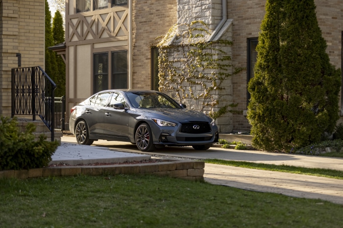 2022 Infiniti Q50S Sensory sedan parked in front of a house