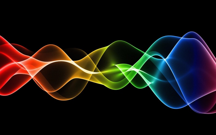 Abstract rainbow waves on black background