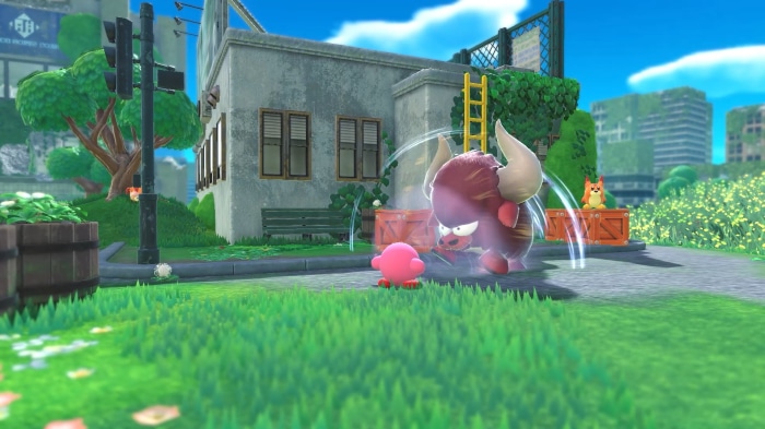 Kirby from Kirby and the Forgotten Land fighting a bull enemy