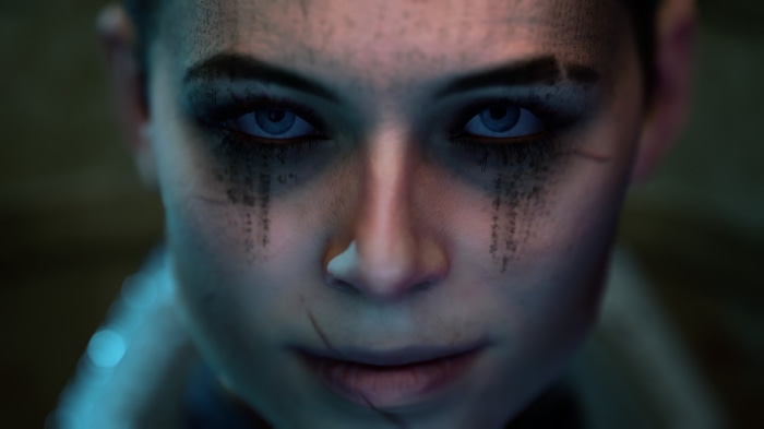 Close-up of a woman's face with blue eyes