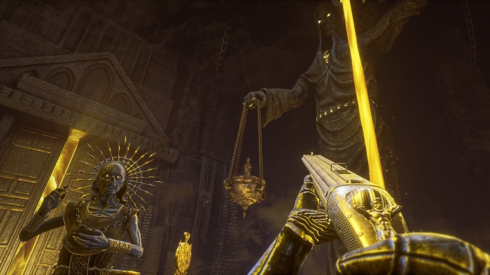 First-person view of a golden gun in a dark temple