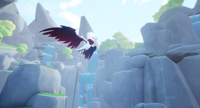 A bird with red and white wings flies over waterfalls.