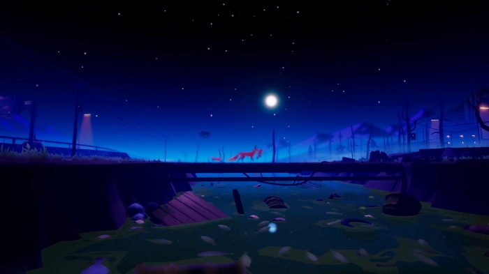 Two foxes on a bridge at night