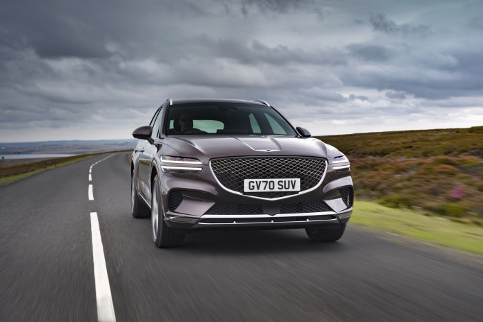 Genesis GV70 SUV driving on a road