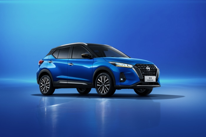 Blue Nissan Kicks SUV on a blue background