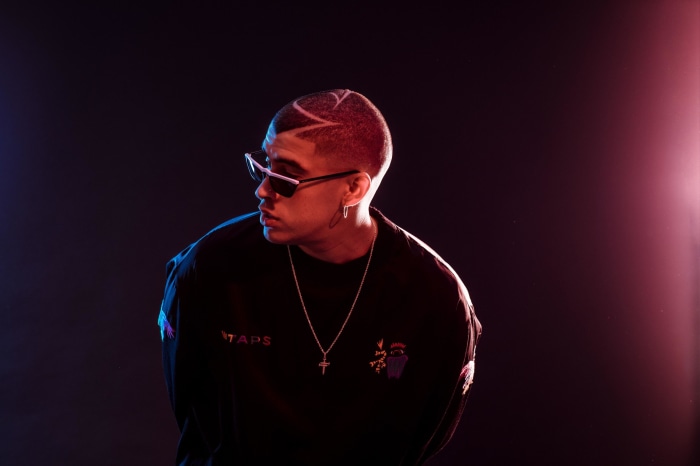 Bad Bunny wearing sunglasses and a necklace