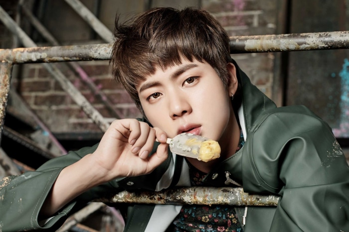 Jin from BTS eating an ice cream bar