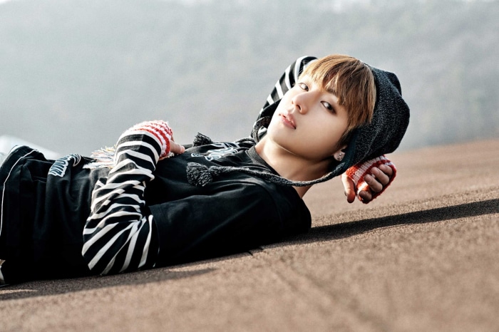V from BTS lying down outdoors