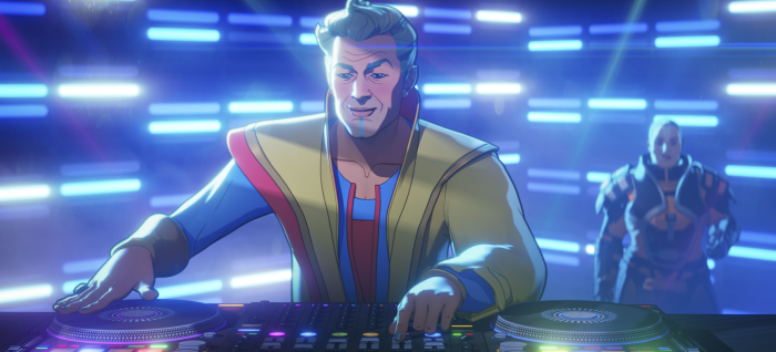 Grandmaster DJing in a club with blue lights