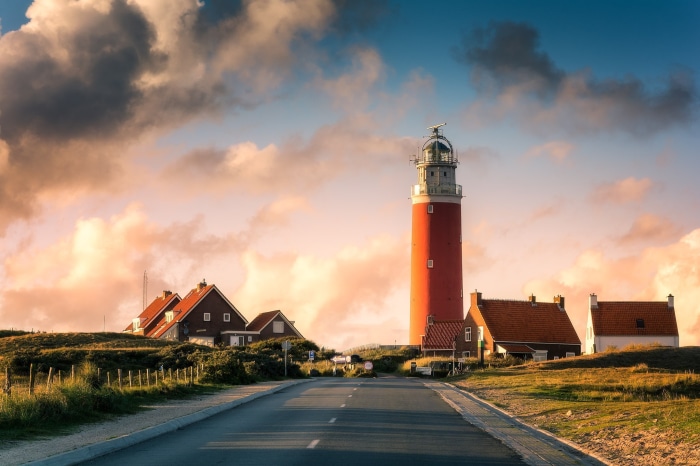 Red lighthouse and houses in Netherlands