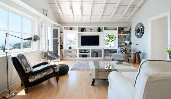 Living room with large windows and built-in entertainment center