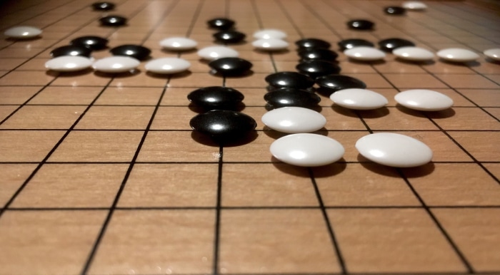 Go board with black and white stones 4K