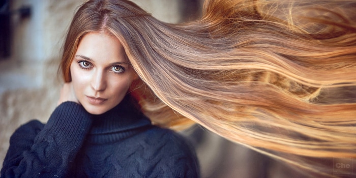 Woman with long flowing auburn hair