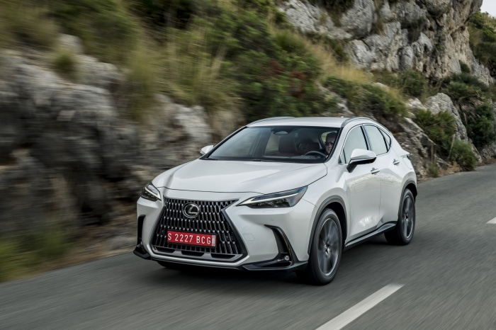 White Lexus NX 250 driving on a mountain road