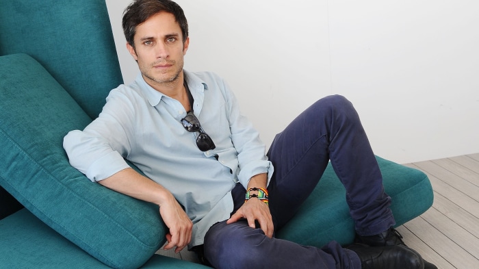 Gael García Bernal sitting on a teal chair