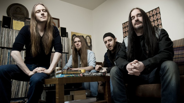 Carcass band members in a room