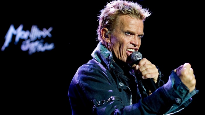 Billy Idol performing on stage