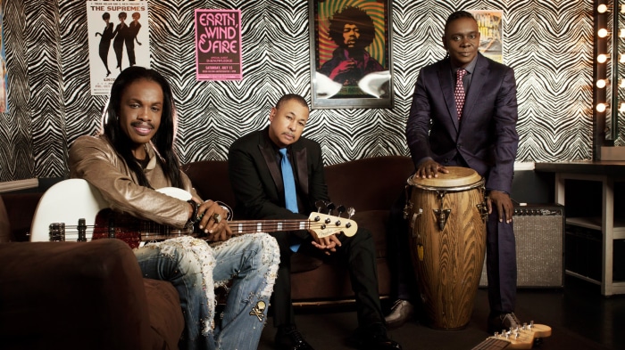 Earth, Wind & Fire band members with instruments