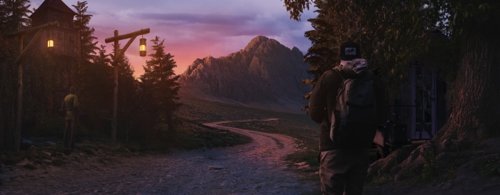 Man with backpack on a dirt road at dawn