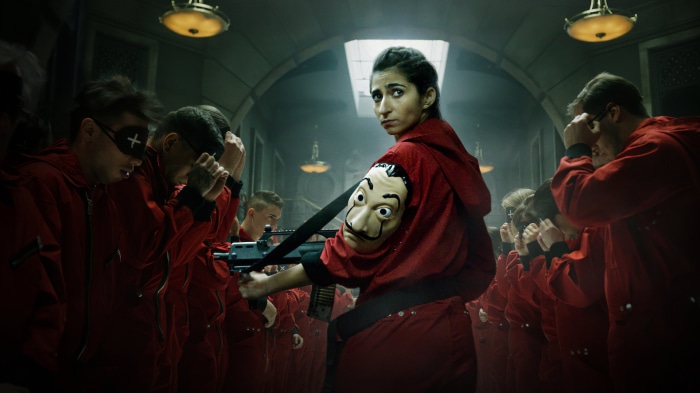 Money Heist characters in red jumpsuits