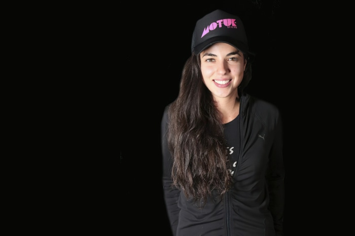 Cristina Rodlo wearing a black cap and jacket