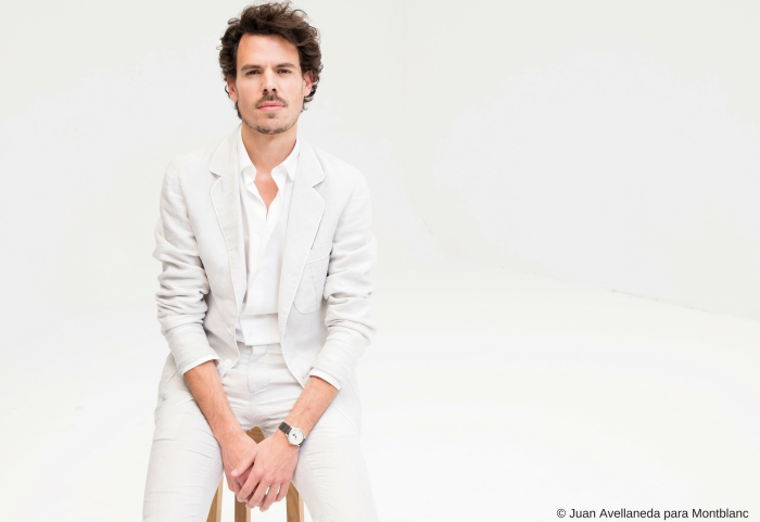 Juan Avellaneda sitting on a stool