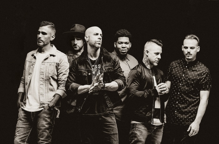 Daughtry band members posing for a photo