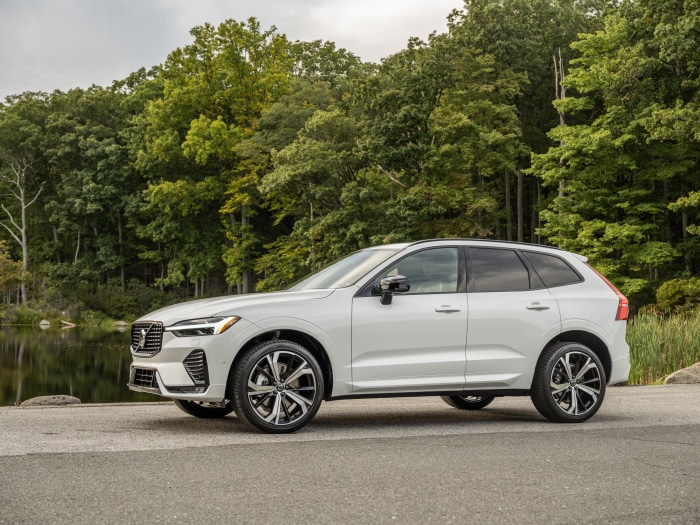 White Volvo XC60 B6 AWD parked by a lake